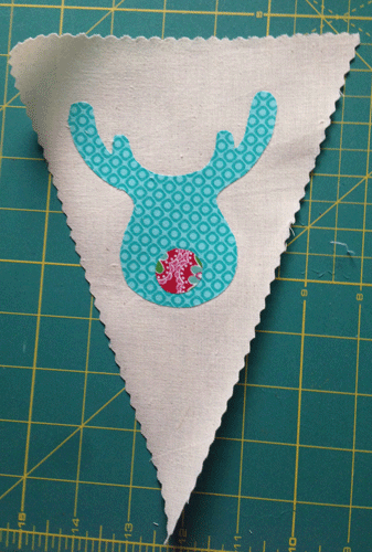Iron your applique pieces onto your fabric flags