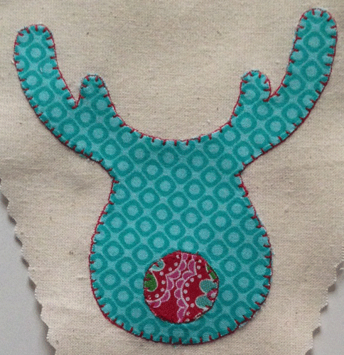 Carefully stitch around the edge of your applique.