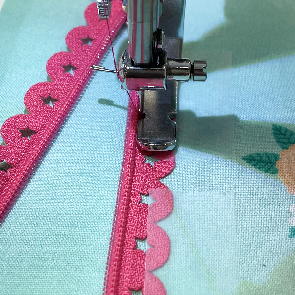 Sew the zip in place with coordinating thread using zipper foot